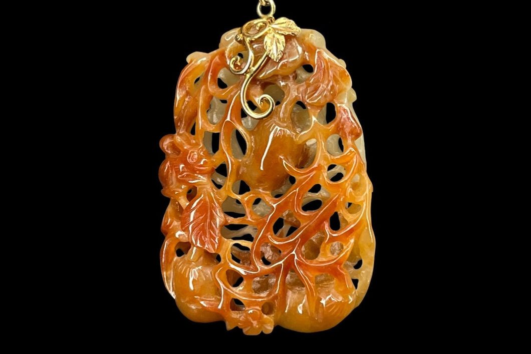 A Qing Dynasty, Squirrel and Grapes Jadeite Pendant